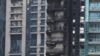 Dubai Fire: Investigators examine fire damage at the high-rise 8 Boulevard Walk in Dubai. (AP) Dubai Fire: Investigators examine fire damage at the high-rise 8 Boulevard Walk in Dubai. (AP)