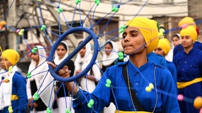 A Sikh youth performs 'Gatka', a form of Sikh martial arts, during a religious procession on the eve of the birth anniversary of Guru Nanak Dev, in Amritsar. (AFP) A Sikh youth performs 'Gatka', a form of Sikh martial arts, during a religious procession on the eve of the birth anniversary of Guru Nanak Dev, in Amritsar. (AFP)
