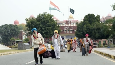 Sikh pilgrims enter Pakistan through the Wagah border near Lahore, Pakistan, Sunday as hundreds of pilgrims arrived in Pakistan to participate in a festival at Nankana Sahib near Lahore for the birth anniversary of their spiritual leader Baba Guru Nanak. (AP) Sikh pilgrims enter Pakistan through the Wagah border near Lahore, Pakistan, Sunday as hundreds of pilgrims arrived in Pakistan to participate in a festival at Nankana Sahib near Lahore for the birth anniversary of their spiritual leader Baba Guru Nanak. (AP)