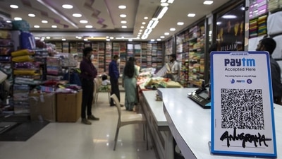 A clothes store displays the QR code for the Paytm digital payment system in Bengaluru..
