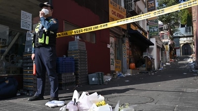 South Korea Halloween Stampede: Flowers are laid at the scene of a Halloween stampede. (AFP) South Korea Halloween Stampede: Flowers are laid at the scene of a Halloween stampede. (AFP)