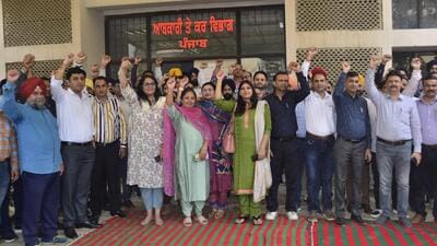 Staff of excise and taxation department observing the pen-down strike in Ludhiana on Monday. (Harvinder Singh/HT)