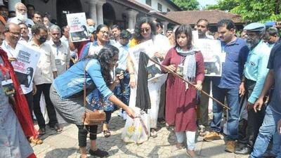 Muslim women burning hijab in Kerala on Sunday. (Twitter Photo)