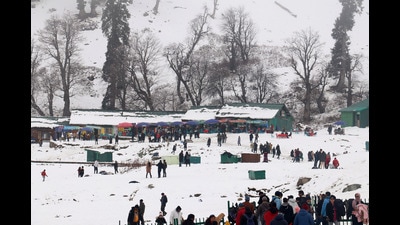 Tourists gather at snowbound Gulmarg Ski Resort as the higher reaches of Kashmir valley received fresh snowfall in Baramulla on Monday. (ANI) Tourists gather at snowbound Gulmarg Ski Resort as the higher reaches of Kashmir valley received fresh snowfall in Baramulla on Monday. (ANI)