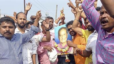 Bhadrak: BJP supporters holding a portrait of former MLA Bishnu Sethi after his son Suryabanshi Suraj won from Dhamnagar segment in Odisha’s coastal district of Bhadrak. (PTI) Bhadrak: BJP supporters holding a portrait of former MLA Bishnu Sethi after his son Suryabanshi Suraj won from Dhamnagar segment in Odisha’s coastal district of Bhadrak. (PTI)