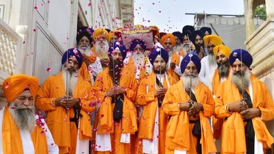 Devotees perform Nagar Kirtan as they carry out Guru Granth Sahib in a special golden palanquin at Golden Temple, Amrtisar. (Sameer Sehgal /Hindustan Times) Devotees perform Nagar Kirtan as they carry out Guru Granth Sahib in a special golden palanquin at Golden Temple, Amrtisar. (Sameer Sehgal /Hindustan Times)