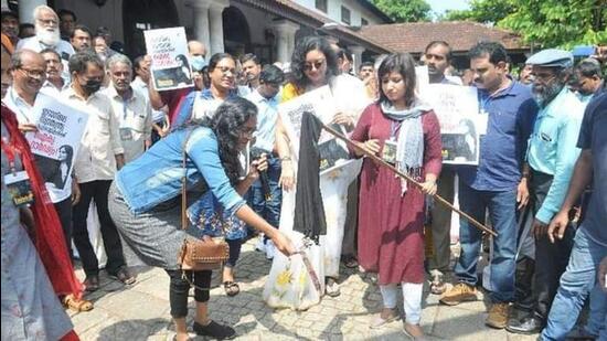Muslim women burning hijab in Kerala on Sunday. (Twitter Photo)