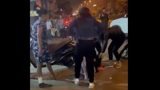 Screen grabbed from the video. While the viral video shows four women attacking the victim, the FIR has so far named only three of them.(Twitter/@FabAbhishek)