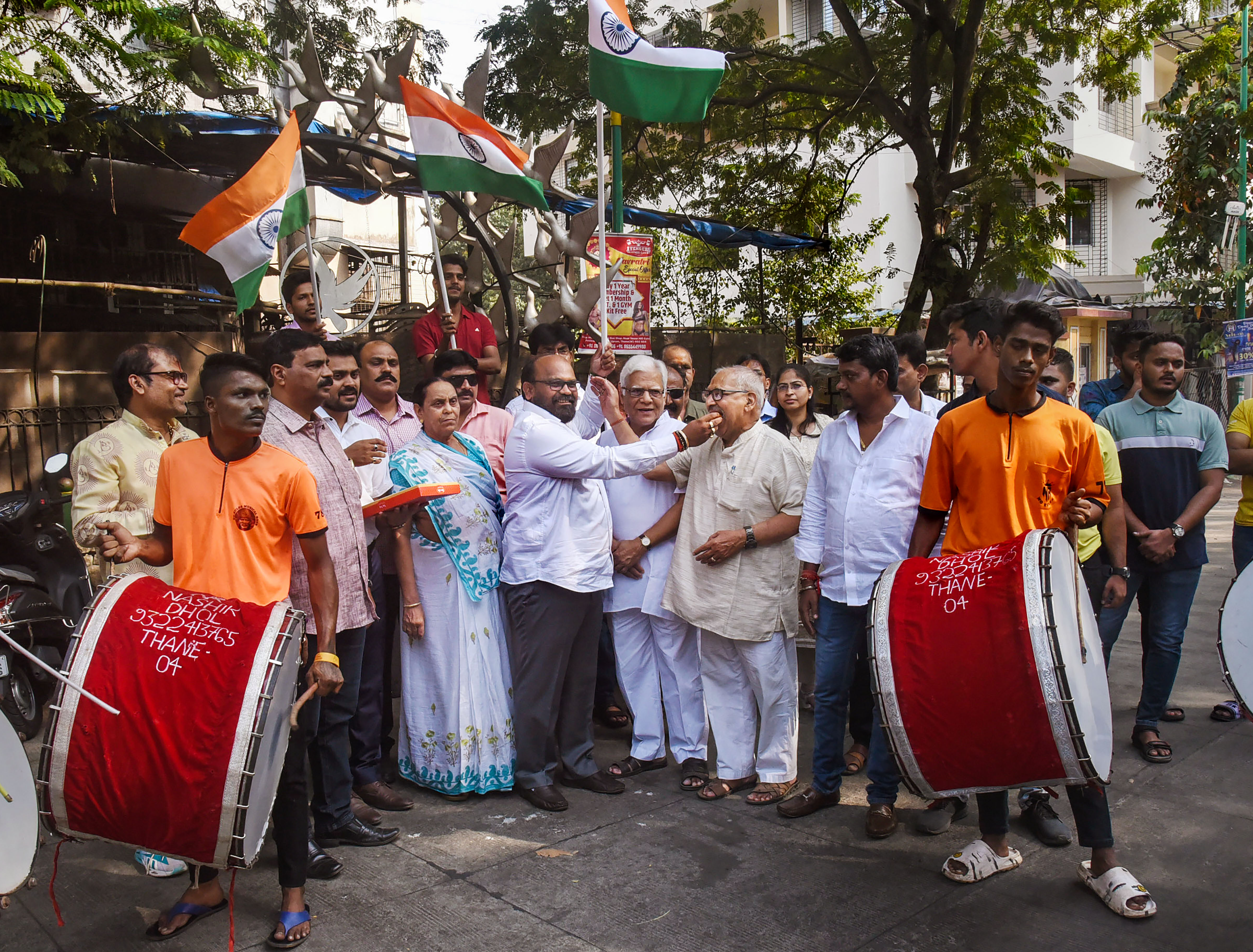 People celebrate Supreme Court's decision to upheld the 10 per cent reservation for economically weaker sections (EWS) in admissions and government jobs, in Thane, Monday. (PTI) People celebrate Supreme Court's decision to upheld the 10 per cent reservation for economically weaker sections (EWS) in admissions and government jobs, in Thane, Monday. (PTI)