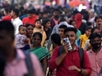 People walk through a crowded commercial street in Chennai.(AFP) People walk through a crowded commercial street in Chennai.(AFP)