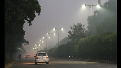 Smog seen on Airport Road in Mohali on Tuesday. (Sanjeev Sharma/HT)
