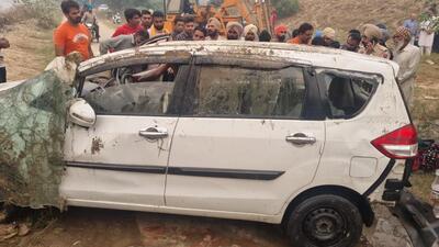 The car after being pulled out of Ferozepur feeder canal on Tuesday. (HT Photo)
