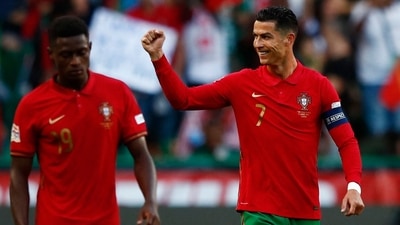 Portugal's Cristiano Ronaldo celebrates scoring a goal with Nuno Mendes. (REUTERS)