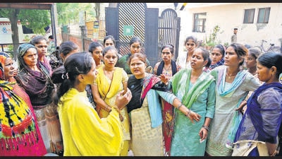 Domestic helps protest over increasing cases of dog bites in Pancham society. (Sanjeev Sharma/HT) Domestic helps protest over increasing cases of dog bites in Pancham society. (Sanjeev Sharma/HT)