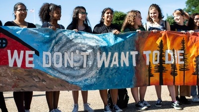 A group of teenage protesters, part of the global movement "Fridays for Future" against climate change in front of the White House in Washington DC. (AFP)