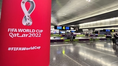 Passengers wait to collect their bags and luggage at the baggage belt area inside Hamad International Airport ahead of the World Cup soccer tournament in Doha, Qatar. (REUTERS)
