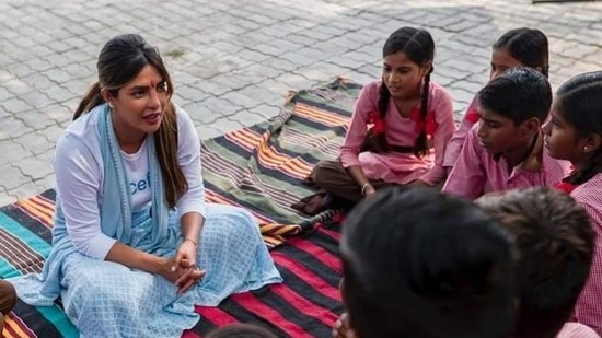 In this picture, Priyanka Chopra can be seen interacting with school students up close and personal.(HT Photo)