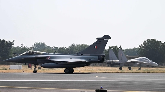 IAF fighter jets Rafale (L) and Sukhoi Su-30MKI land during the joint exercise 'Ex Garuda-VII' between IAF and French Air and Space Force at Jodhpur in Rajasthan. (AFP)
