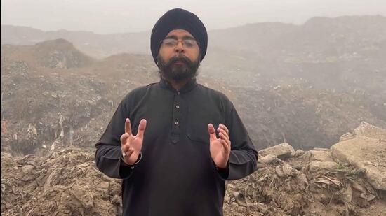 Tajinder Pal Singh Bagga, national secretary BJYM, at the main MC dumping site on Tajpur road in Ludhiana. In total, over 25 lakh metric tonnes of garbage have accumulated at the site over a few decades. (HT PHOTO)