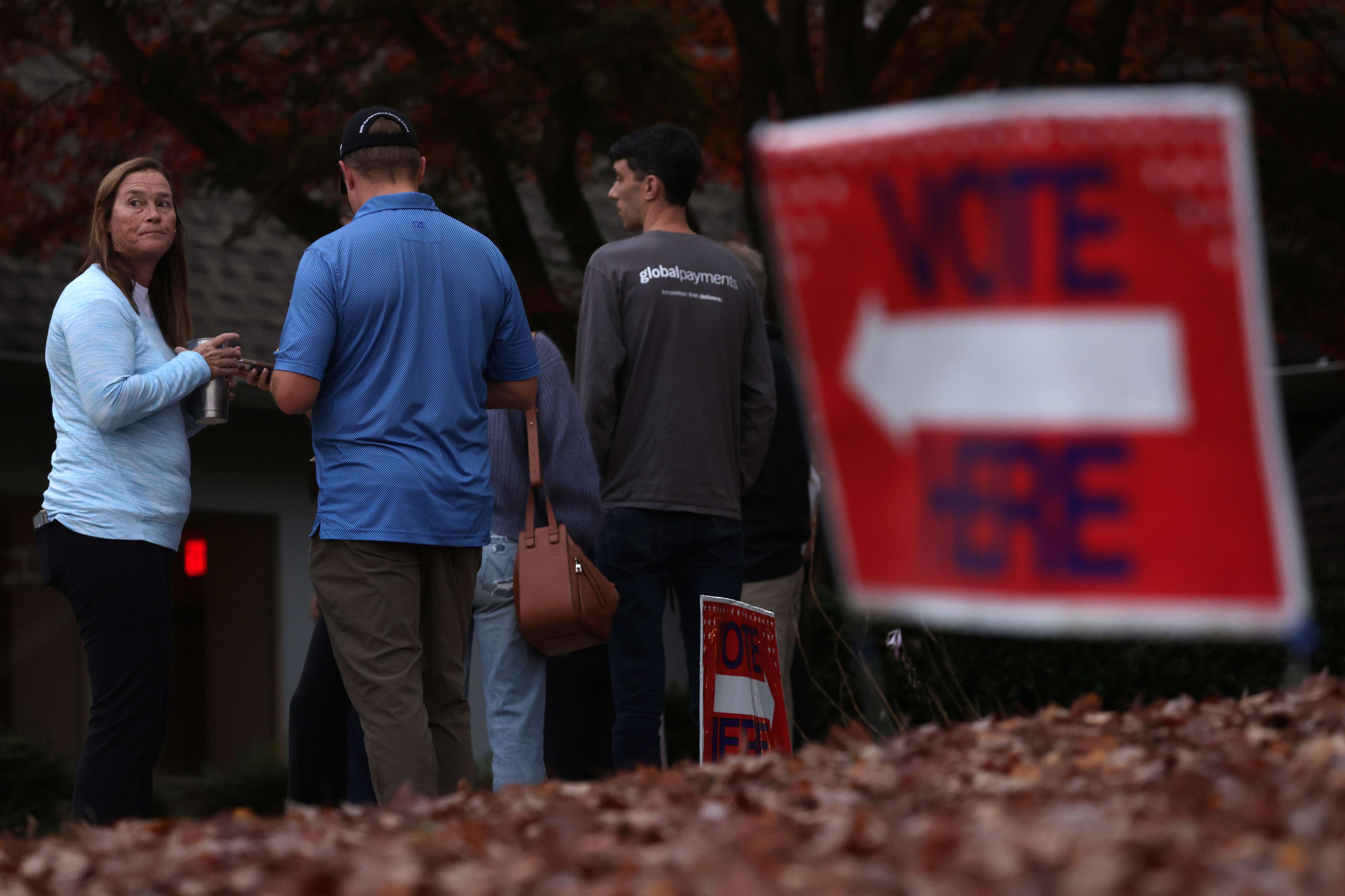 US midterm elections: Voters wait in-line outside a polling place for casting their ballots in Sandy Springs, Georgia. (AFP)