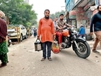 Mukhtar walks down the lanes of Nizamuddin Basti with the tea thermos in one hand and a bag filled with plastic glasses in the other. Mukhtar walks down the lanes of Nizamuddin Basti with the tea thermos in one hand and a bag filled with plastic glasses in the other.