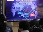 A TV screen showing a news program reporting on North Korea's missile launch. A TV screen showing a news program reporting on North Korea's missile launch.