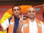 Vijay Rupani (in a blue jacket) and Nitin Patel(PTI file) Vijay Rupani (in a blue jacket) and Nitin Patel(PTI file)