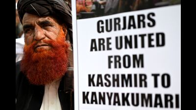 Members of the Gujjar and Bakerwal communities display banners during a demonstration in New Delhi on November 1, 2022, to protest a proposed move to grant scheduled tribe (ST) status to certain communities, including Pahari-speaking people, in Jammu and Kashmir. (AFP) Members of the Gujjar and Bakerwal communities display banners during a demonstration in New Delhi on November 1, 2022, to protest a proposed move to grant scheduled tribe (ST) status to certain communities, including Pahari-speaking people, in Jammu and Kashmir. (AFP)