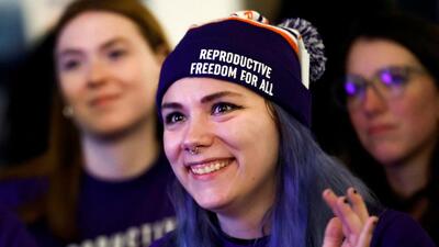 Women cheer as they hear early voting results indicating the passage of Proposal 3, a midterm ballot measure that enshrines abortion rights, during a Reproductive Freedom For All watch party on US midterm election night in Detroit, Michigan, on Tuesday. (REUTERS)