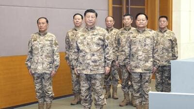 Chinese President Xi Jinping (front centre) inspects the Central Military Commission joint operations command centre in Beijing. (AP) Chinese President Xi Jinping (front centre) inspects the Central Military Commission joint operations command centre in Beijing. (AP)