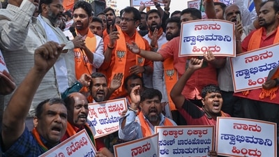 Karnataka Bharatiya Janata Party (BJP) members stage a protest demonstration against state Congress leader Satish Jarkiholi for his controversial remarks on the Hindu community, in Bangalore on November 9. (AFP) Karnataka Bharatiya Janata Party (BJP) members stage a protest demonstration against state Congress leader Satish Jarkiholi for his controversial remarks on the Hindu community, in Bangalore on November 9. (AFP)