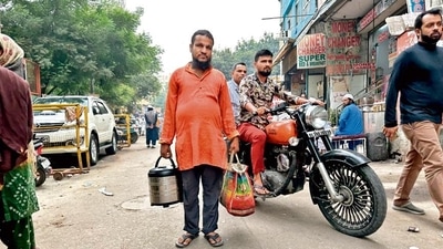 Mukhtar walks down the lanes of Nizamuddin Basti with the tea thermos in one hand and a bag filled with plastic glasses in the other. Mukhtar walks down the lanes of Nizamuddin Basti with the tea thermos in one hand and a bag filled with plastic glasses in the other.