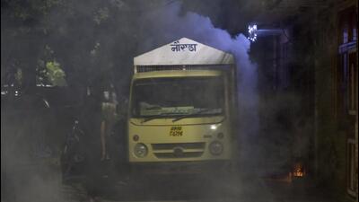Health workers conduct a fumigation drive in Noida on Wednesday. (Sunil Ghosh/HT Photo) Health workers conduct a fumigation drive in Noida on Wednesday. (Sunil Ghosh/HT Photo)