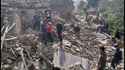 Nepalese villagers stand amidst the debris of their mudhouses after an earthquake in Doti district, Nepal, Wednesday, November 9, 2022. (AP/PTI Photo) Nepalese villagers stand amidst the debris of their mudhouses after an earthquake in Doti district, Nepal, Wednesday, November 9, 2022. (AP/PTI Photo)