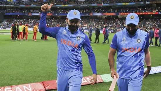 Virat Kohli and Mohammed Shami leave the field (AP)