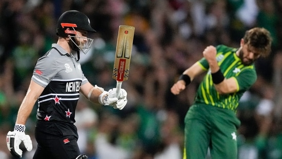 New Zealand's Kane Williamson, left, walks from the field after he was bowled by Pakistan's Shaheen Afridi, right, during the T20 World Cup cricket semifinal between New Zealand and Pakistan in Sydney, Australia, Wednesday, Nov. 9, 2022. (AP Photo/Rick Rycroft)(AP)