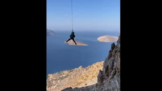 Three-year-old swings from a mountain.(Instagram/@smileysproject)