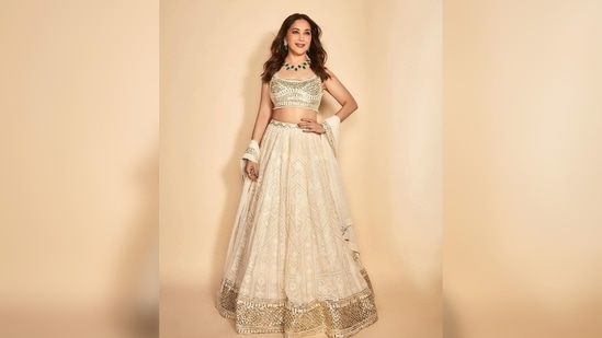 Madhuri Dixit's outfit comes with a sequins sleeveless blouse, a lehenga and a matching dupatta.(Instagram/@madhuridixitnene)