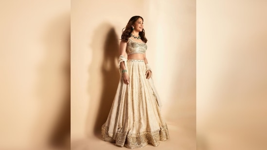 Madhuri Dixit teamed her modern lehenga set with an emerald green neckpiece.(Instagram/@madhuridixitnene)