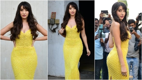 Nora Fatehi displays her curvy silhouette in deep-neck yellow embellished gown, (HT Photo/Varinder Chawla)