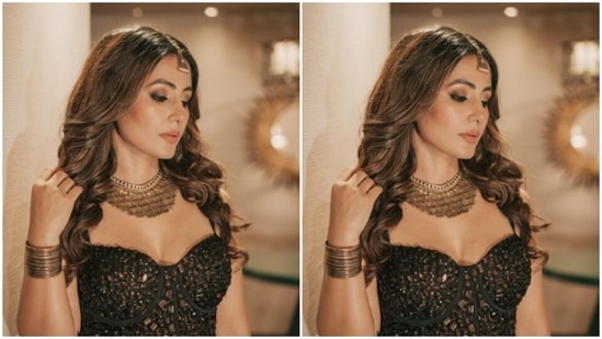 Hina looked pretty as ever as she decked up in a black corset cropped top with sleeveless details. The top featured pieces of black mirror details throughout. (Instagram/@realhinakhan)