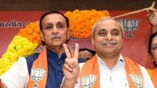 Vijay Rupani (in a blue jacket) and Nitin Patel(PTI file)