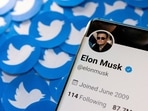 Elon Musk's Twitter profile is seen on a smartphone placed on printed Twitter logos in this picture illustration taken April 28, 2022. REUTERS/Dado Ruvic/Illustration/File Photo