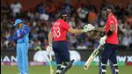 England's Captain Jos Buttler (C) and Alex Hales bump gloves during the ICC men's Twenty20 World Cup 2022 semi-final cricket match between England and India at The Adelaide Oval on November 10, 2022 in Adelaide. (AFP) England's Captain Jos Buttler (C) and Alex Hales bump gloves during the ICC men's Twenty20 World Cup 2022 semi-final cricket match between England and India at The Adelaide Oval on November 10, 2022 in Adelaide. (AFP)