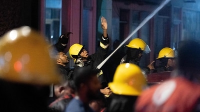 Maldives Fire: Firefighters try to douse a fire that broke out in a building lodging foreign workers in Maldives capital Male. (AFP) Maldives Fire: Firefighters try to douse a fire that broke out in a building lodging foreign workers in Maldives capital Male. (AFP)