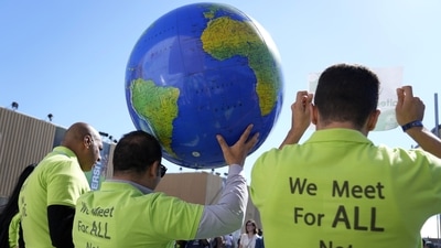 Demonstrators hold a globe during the COP27 U.N. Climate Summit, Thursday. (AP) Demonstrators hold a globe during the COP27 U.N. Climate Summit, Thursday. (AP)