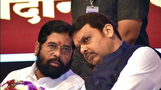 Mumbai, Nov 03 (ANI): Maharashtra Chief Minister Eknath Shinde and Deputy Chief Minister Devendra Fadnavis indulge in a conversation during a programme of awarding of appointment letters under State level employment fair to the first phase candidates, at Yashwantrao Chavan Centre, in Mumbai on Thursday. (ANI Photo) (Deepak Salvi)