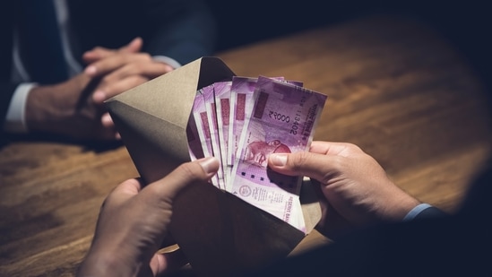 The Panchayat Development department have been demanding lakhs of rupees as bribe to clear paperwork for their property. (Getty Images/iStockphoto)