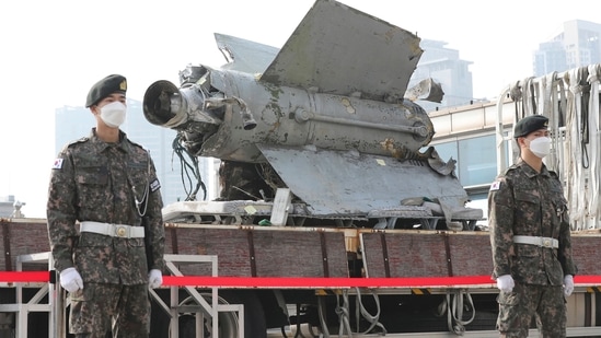 North Korea: South Korean army soldiers stand in front of the debris of a missile.(AP)