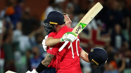 England's Captain Jos Buttler (L) and Alex Hales celebrate their win after the ICC men's Twenty20 World Cup 2022 semi-final cricket match between England and India at The Adelaide Oval(AFP)